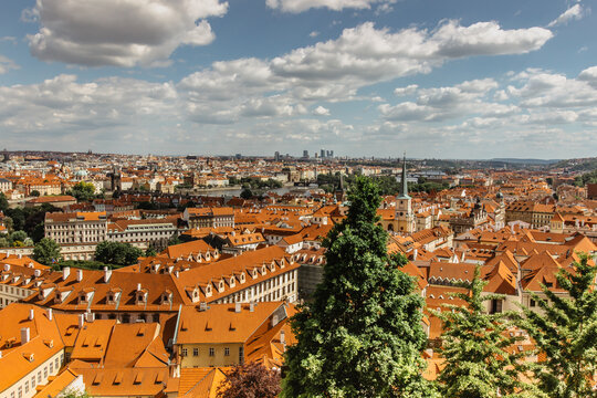 Fototapeta Amazing European cityscape.Aerial view of old town with hictorical buildings,red roofs,churches,skyscrapers in Prague,Czechia.Prague panorama.Beautiful sunny landscape of the capital of Czechia.
