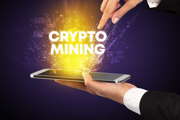 Close-up of a touchscreen with CRYPTO MINING inscription, innovative technology concept