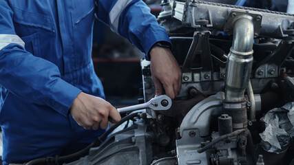 Mechanic auto mechanic in uniform repairing.car in auto machine tools ready to be used with car service.selective focus.