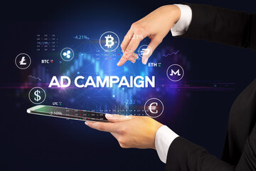 Close-up of a touchscreen with AD CAMPAIGN inscription, business opportunity concept