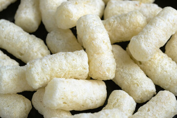 Corn air sticks in powdered sugar