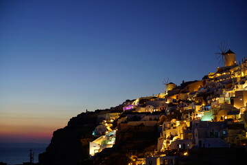 Sunset view and beautiful buildings lighted by sunset in santorini island, Greece, Europe