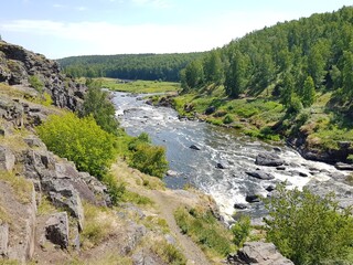 Stone boulders in a mountain river