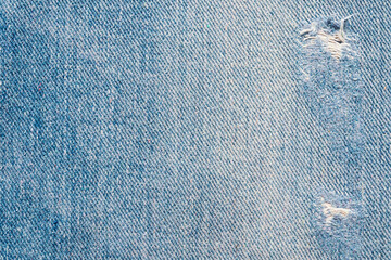 Denim blue jeans torn fashion design texture close up background top view