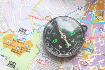 round classic compass on tourist map as symbol of tourism with compass, travel with compass and outdoor activities with compass