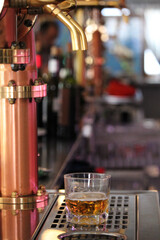 Bartender serving a beer rod from a tap