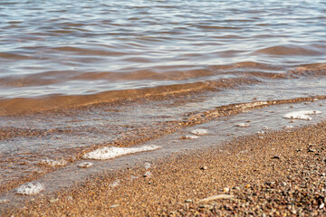 Calm surf in the evening sun.