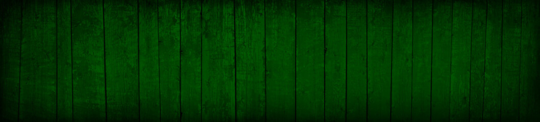 Dark green old wooden background. Green wood planks background. Baner with toned texture of vintage painted board