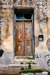 PYRGOS, Greece, Old door of abandoned house, in the city of Pyrgos, Ileia prefecture, Peloponnese, Greece.