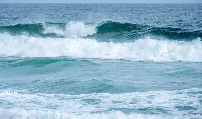 Naklejka na ściany i meble Blue waters of the Indian Ocean with waves breaking in Sri Lanka