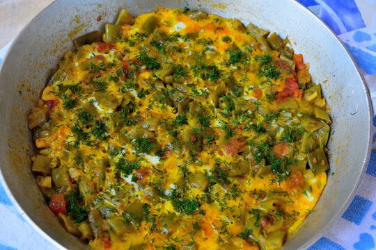 Traditional Azerbaijani summer dish called &ldquo;Green bean chigirtma&rdquo; made with fresh green beans, onions, eggs, tomatoes and spices, and sprinkled with fresh chopped dill