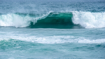 Blue waters of the Indian Ocean with waves breaking in Sri Lanka