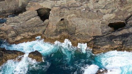 mighty ocean spitting out the cliffs