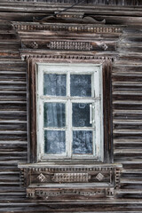 Vintage windows of russian old wooden house