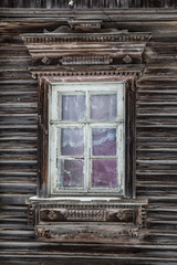 Vintage windows of russian old wooden house