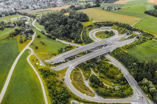 aerial view of modern motorway with tunnels and on and off