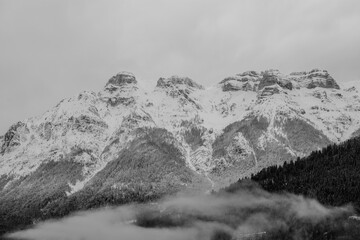 Fototapeta na wymiar foggy snow covered mountains vintage