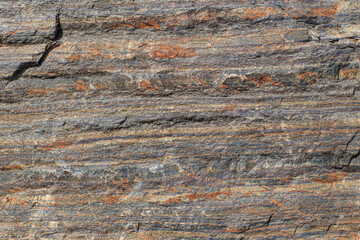 Stone texture with layers of orange