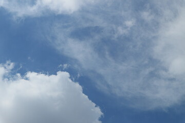 White clouds against blue sky background