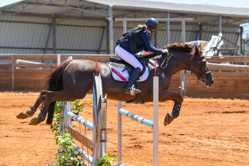 Rider jumps over obstacles during horse show jumping