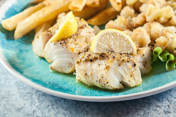 Steamed cod fish with french fries and boiled cauliflower