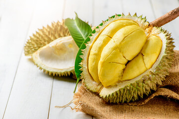 Fresh durian (Kan yao) or Durio zibthinus Murray on sack and old wood background,