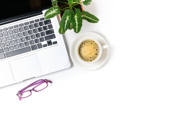 Laptop and eye glasses with black coffee isolated on white