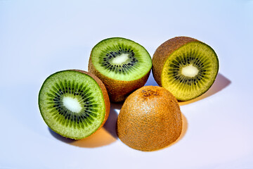 Kiwis sliced on white background