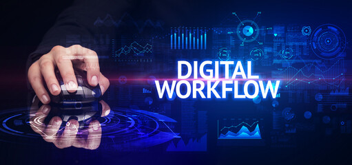 hand holding wireless peripheral with DIGITAL WORKFLOW inscription, modern technology concept