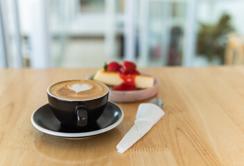 cup of cappuccino coffee and cake