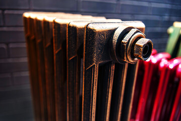 Cast iron radiator in retro style. Modern heating equipment for the home. Trading plumbing in the store