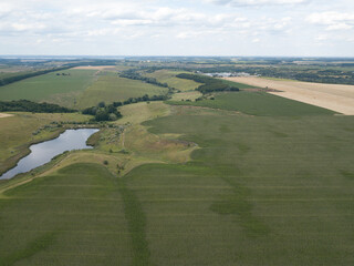 Aerial drone view. Ukrainian agricultural fields in summer.