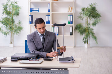 Young male employee after accident at workplace