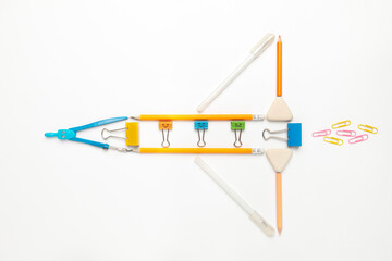 A rocket made of pencils on a white background, the pursuit of success, children's imagination and learning. Free thinking, innovative ideas.