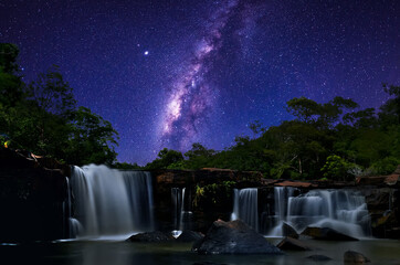 Milky Way galaxy onTat Ton Waterfall Chaiyaphum Province, Thailand.Long exposure photograph, with grain.Image contain certain grain or noise and soft focus.