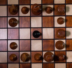 top down view of black pawn surrounded
