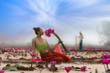 woman in flower lotus lake, Woman wearing traditional Thai people 