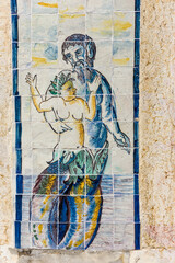 mythological azulejos and statue on the walls of The Palace of the Marquesses of Fronteira in Lisbon, Portugal
