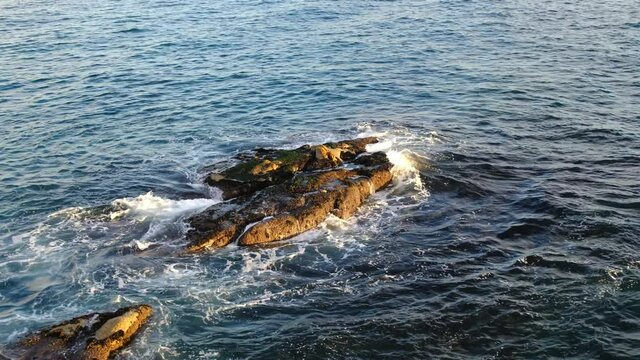 Ocean waves crashing and foaming.