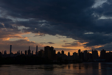 Dark Manhattan Skyline Silhouette along the East River during Sunset in New York City