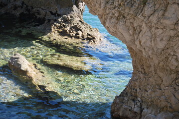
marine cave entrance among the rocks
