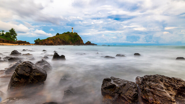 The Lighthouse with rock used long exposure photography at Lanta island, Krabi, Thailand
