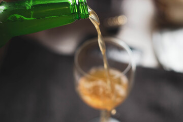 cold beer is poured into the glass