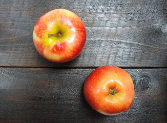 Fresh raw apples on wooden boards     