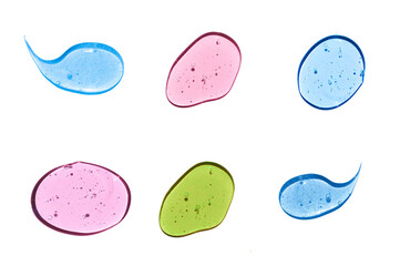 Multicolored assortment of samples of cosmetic gels isolated on  white background.