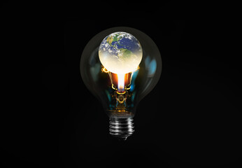 Burning candle in the light bulb with bulb isolated on black background - Light bulb with world inside and global warming isolated on black "Elements of this image furnished by NASA