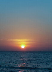 Sunset off the coast of Thailand on a warm evening. Summer, vacation, sea, beach.