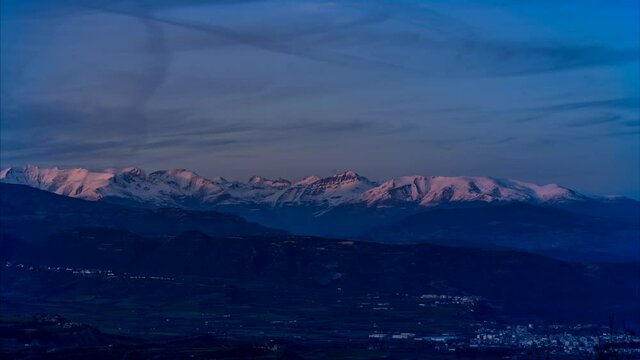 Landscape with mountains and clouds movement at sunset with telephoto lens, video time lapse