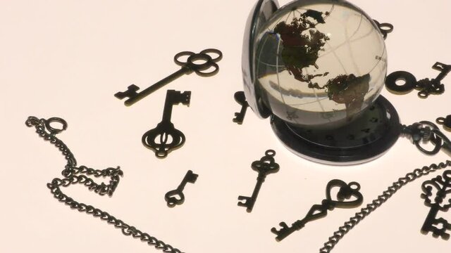 Glass globe and several types of antique keys.