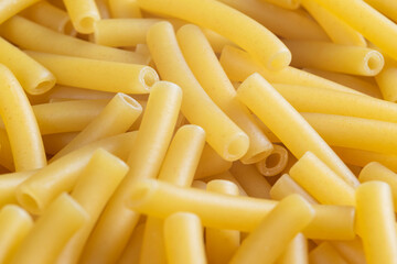 Macro shot pasta noodles texture. Macaroni background pattern. Top view. Dry pasta for cooking. Abstract italian macaroni background